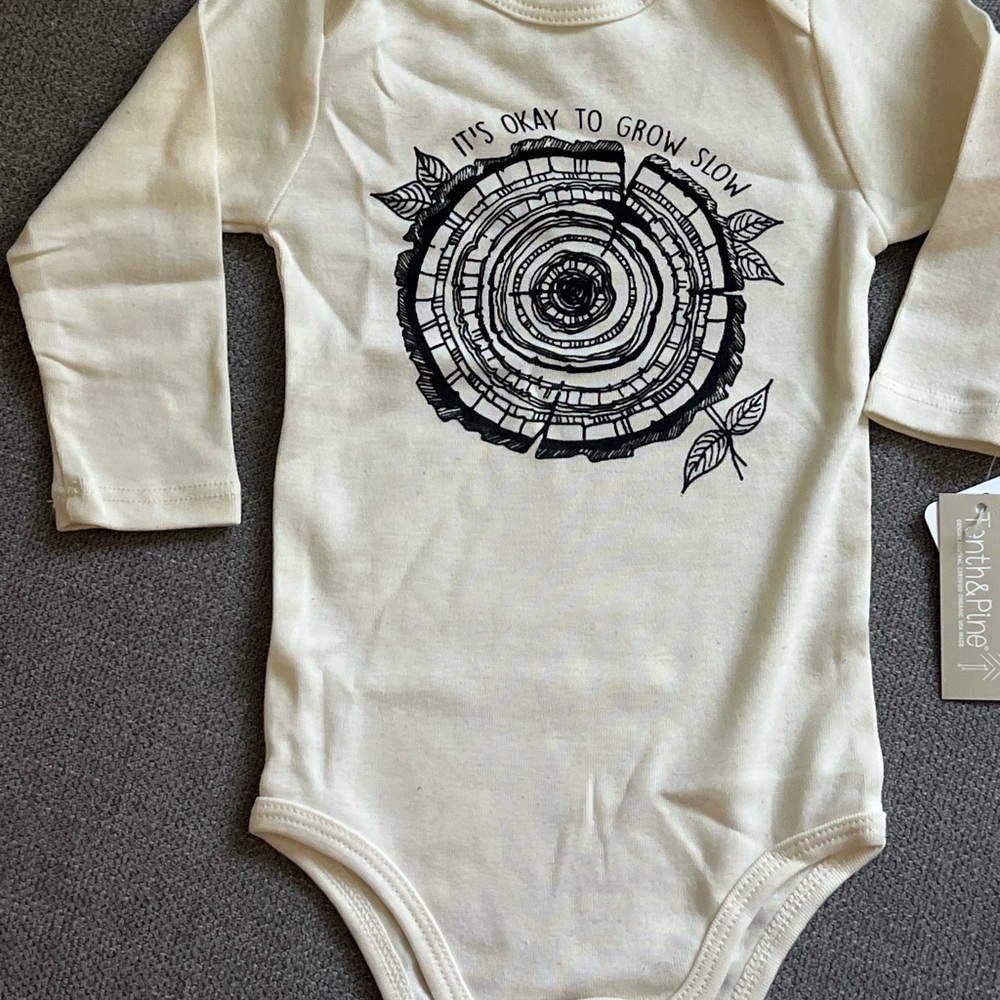 “It’s ok to grow slow” Cream and Black Onesie